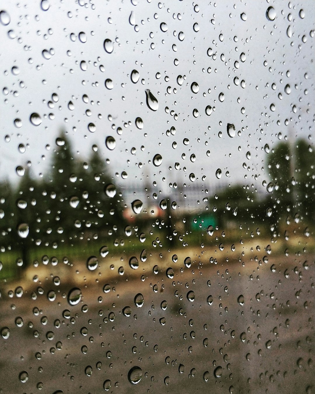 rain-drops-on-the-window-of-a-car-on-a-rainy-day-sxzrra29deg